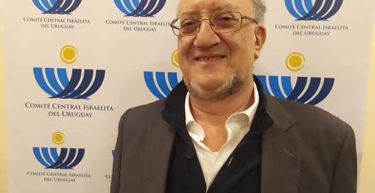 Marcos Israel, sonriente De fondo, logos del CCIU